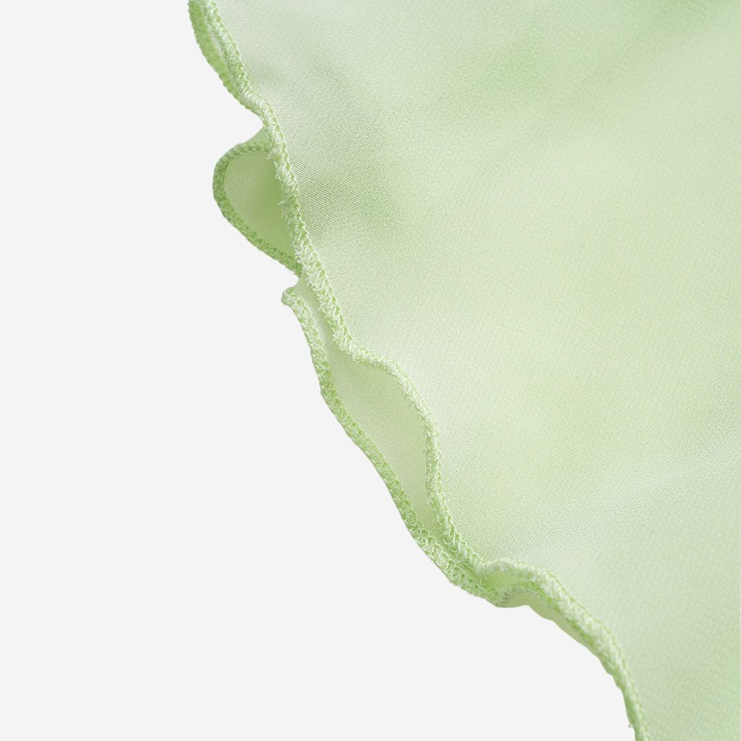 Ljusgrön chiffontunika med volangärmar och rynkad halsringning