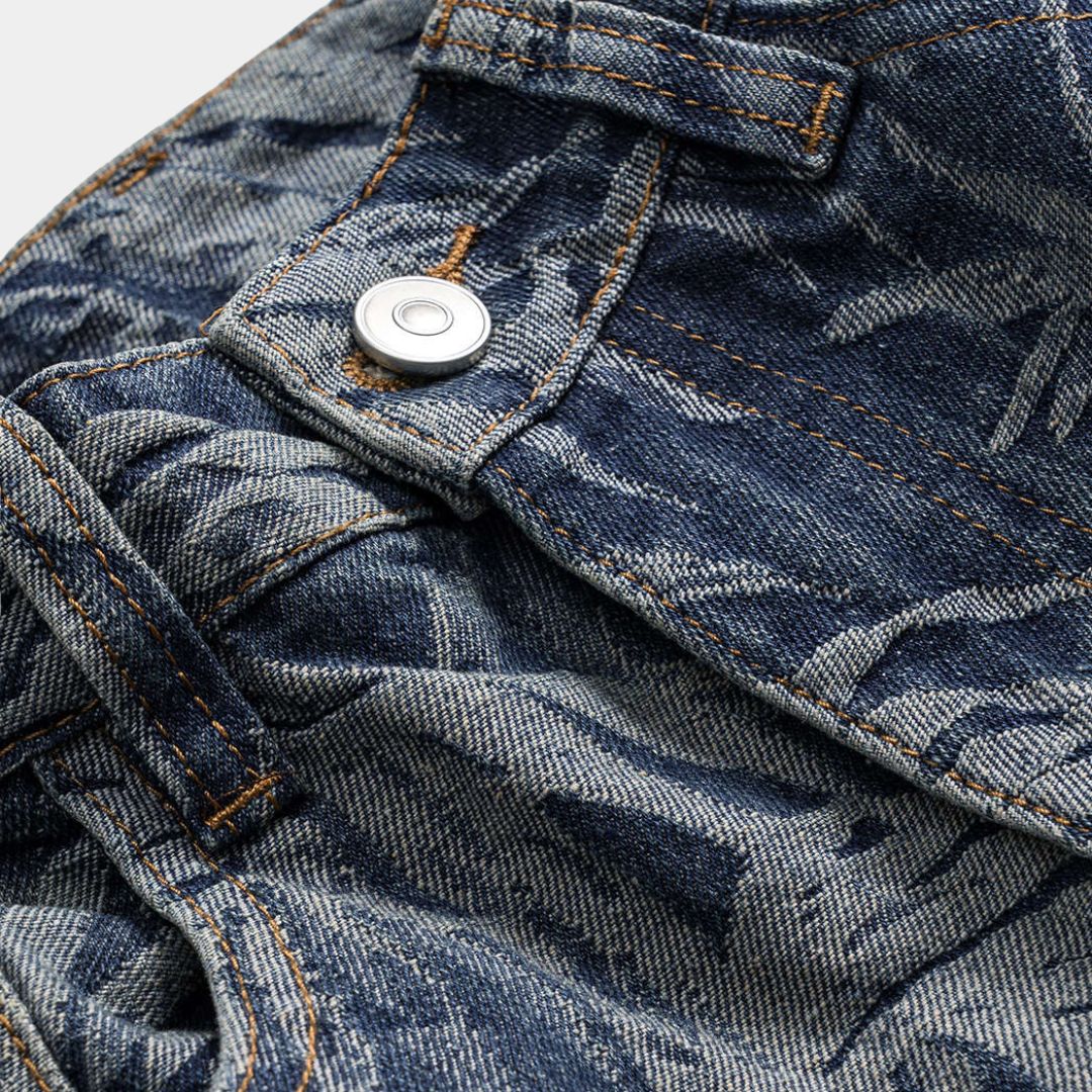 Tonade blå denimjeans med vävt bladmönster, hög midja och rak vida passform i bomullsblandning