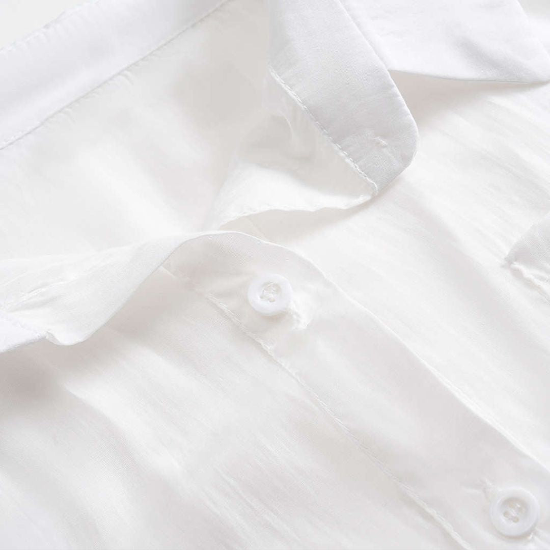 Vit Figurnära lång topp i vävd semitransparent polyester med rund hals och mjukt fall