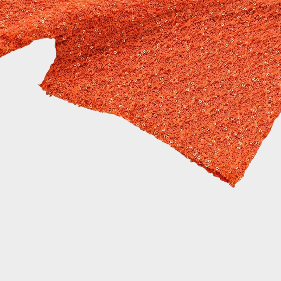 Orange stickad kofta med kort ärm paljettdetaljer och dekorativ knapp