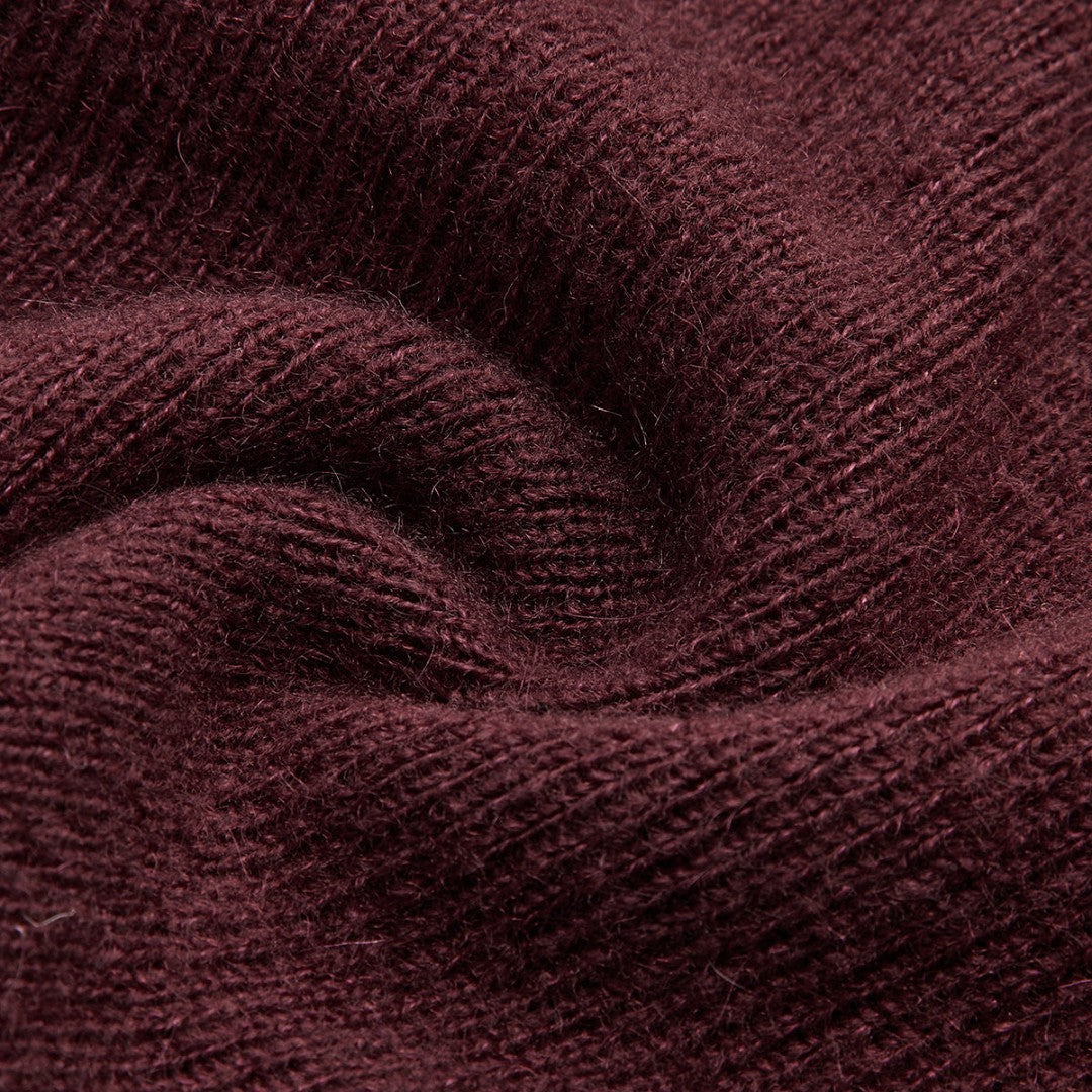 Tunn stickad topp med 3D-blommor och transparent överdel i ullmix