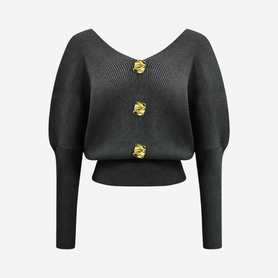 Stickad topp med dekorativa knappar och djup urringning för elegant vardagsstil