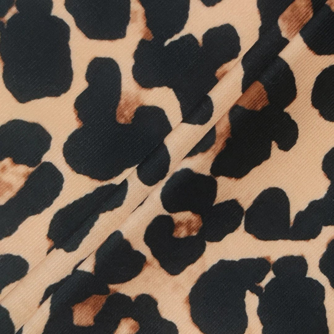 Leopardmönstrad topp med uringning och långa ärmar