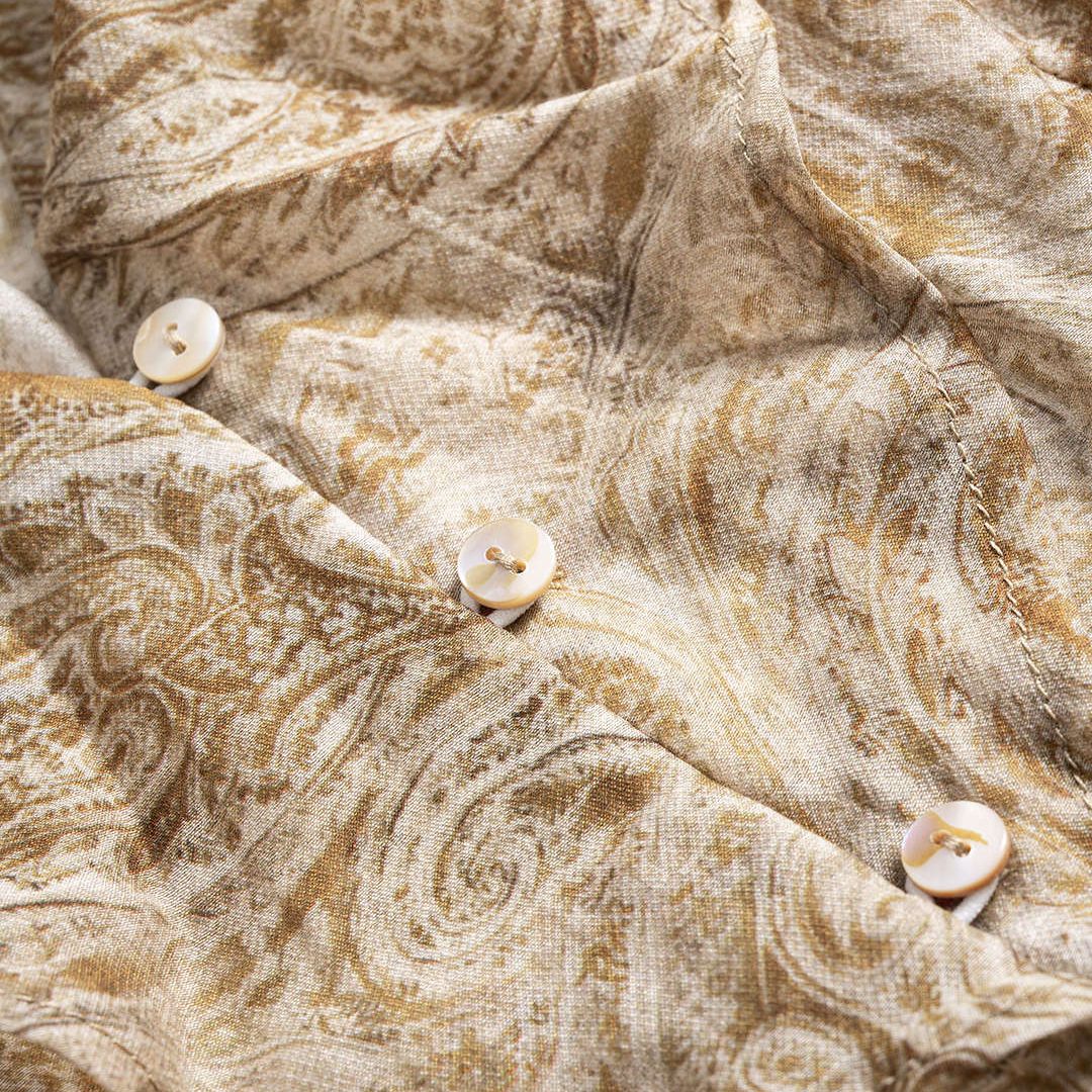 Khaki paisleymönstrad topp med volangdetaljer och utsvängda ärmar i figurnära jersey