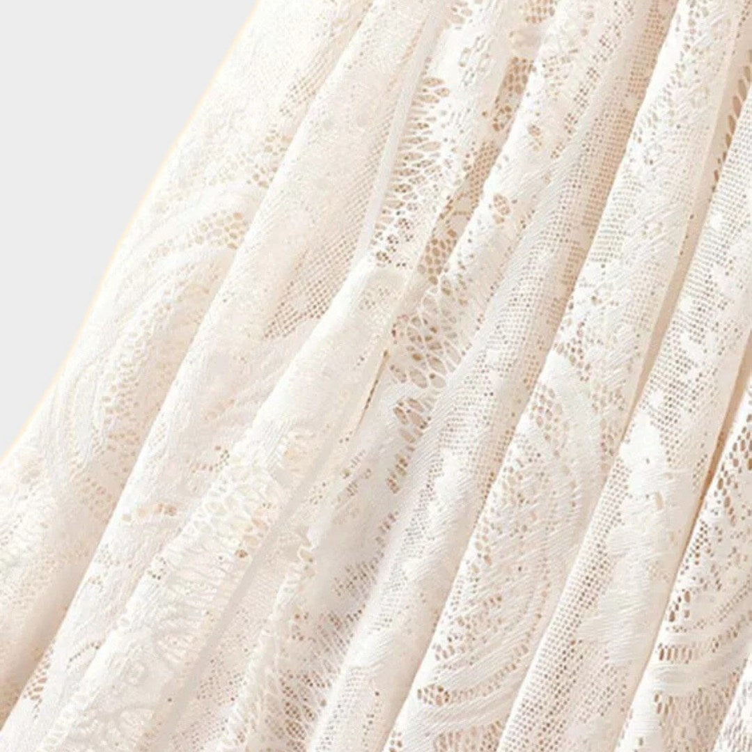 Kjol i spets med naturlig midja, ankellängd, A-linje silhuett och delikat struktur