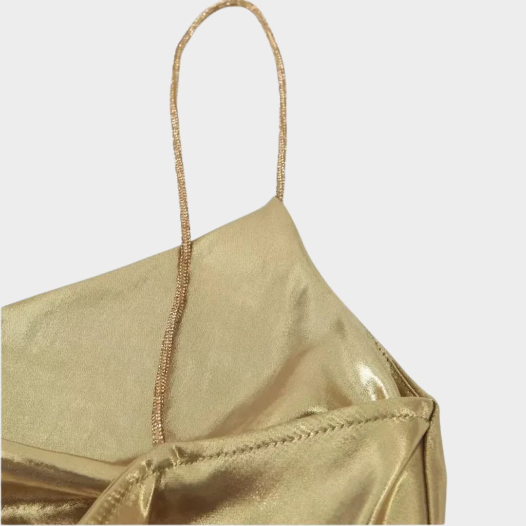 Glittrande miniklänning med smala axelband och öppen rygg