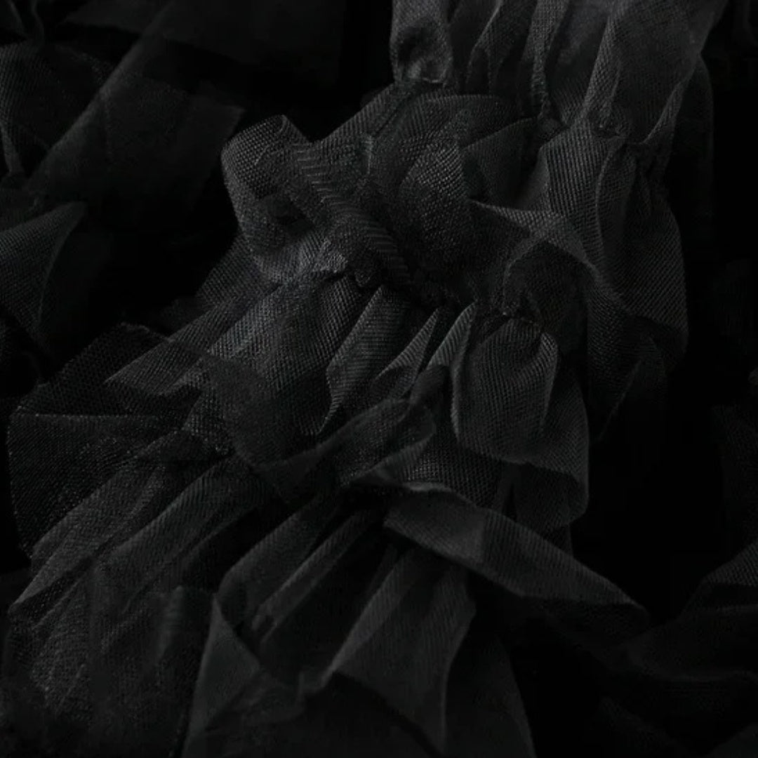 Kjol i mesh med volanger empiremidja A-linje silhuett och lagerstruktur