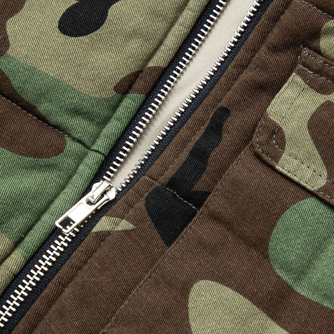 Ärmlös vadderad denimväst med huva och sidosnörning