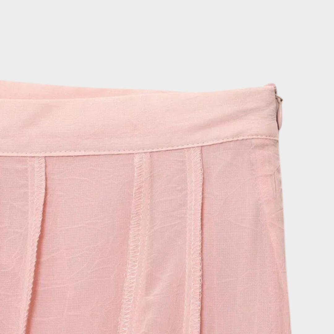 Ljusrosa Långkjol i ljusrosa med A-linjeform och svepande silhuett