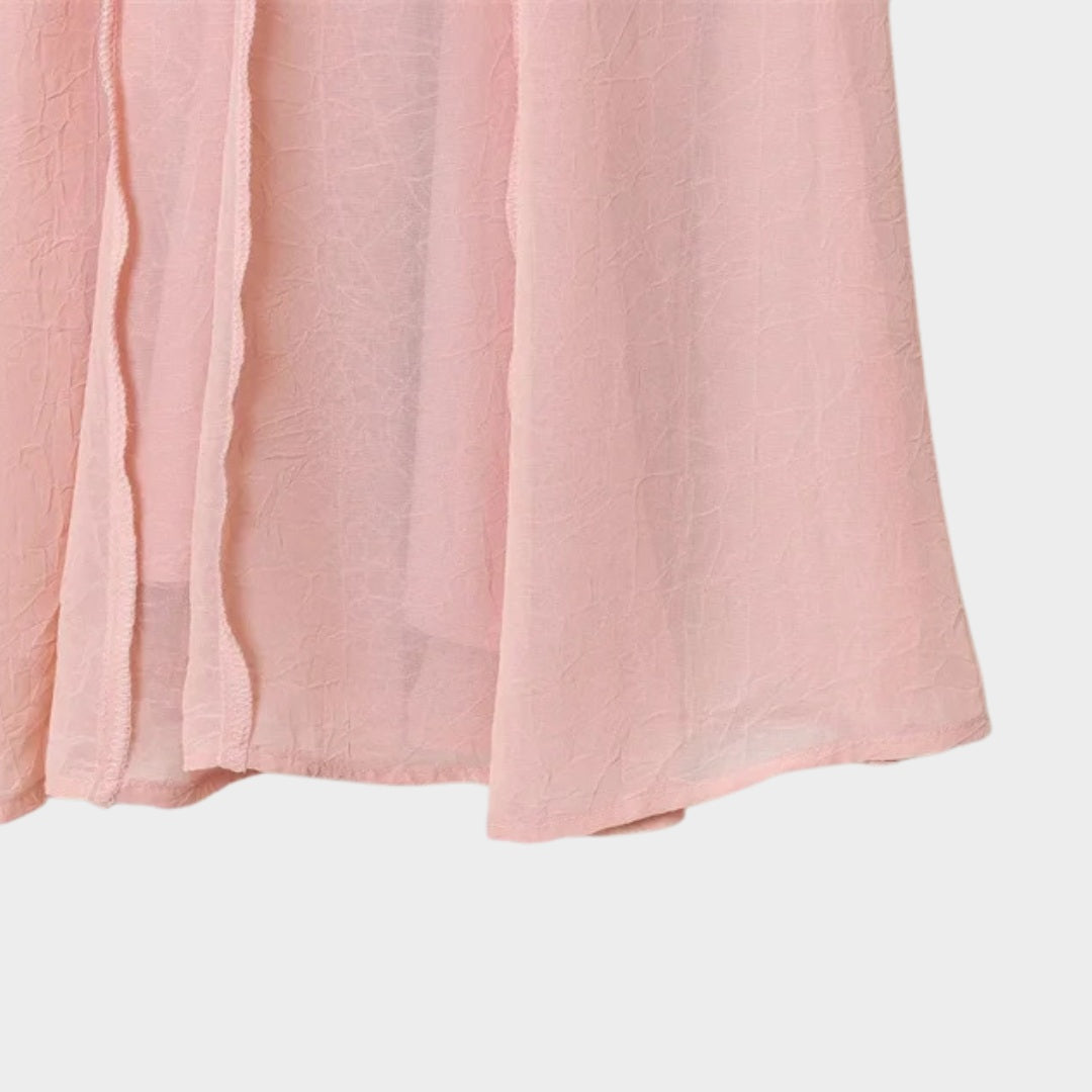 Ljusrosa Långkjol i ljusrosa med A-linjeform och svepande silhuett