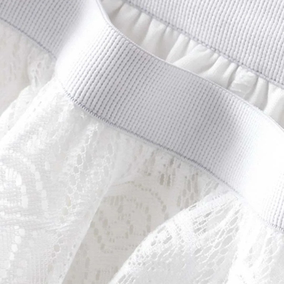 Kjol i spets med naturlig midja, ankellängd, A-linje silhuett och delikat struktur