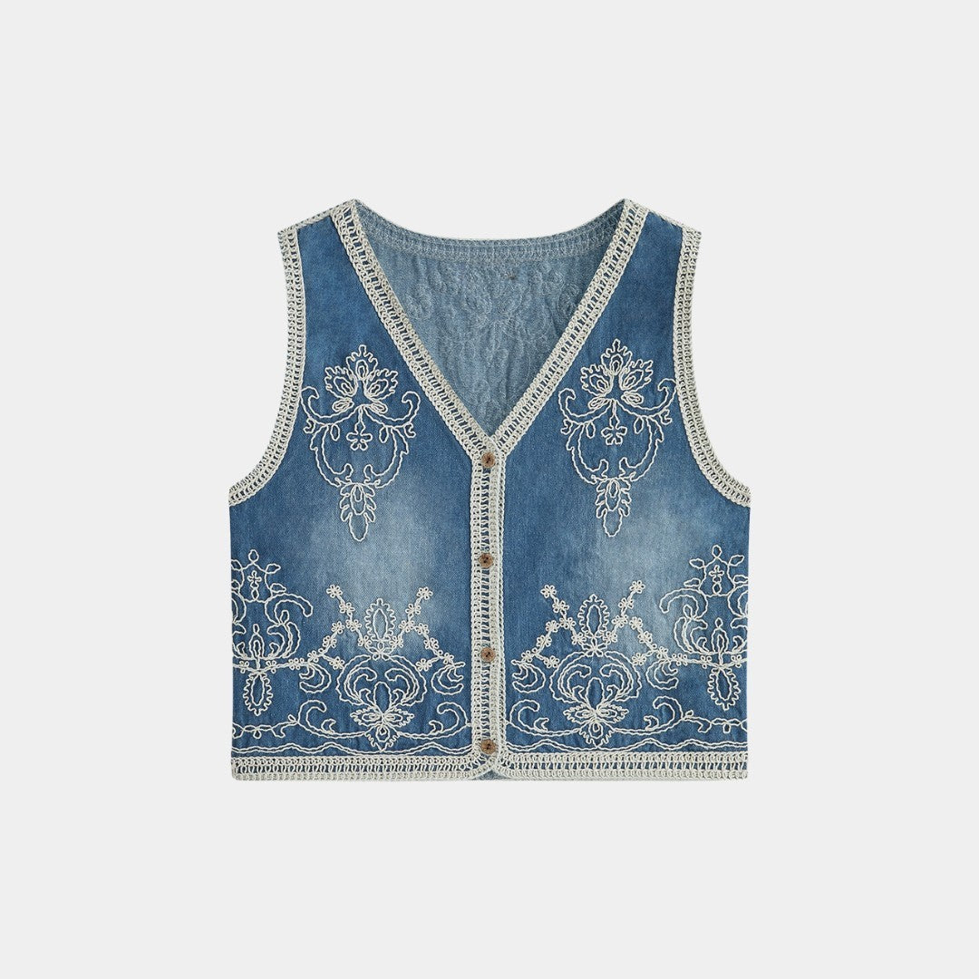 Ärmlös ljusblå jeansväst med dekorativ brodyr och virkade kanter i bomullsmix