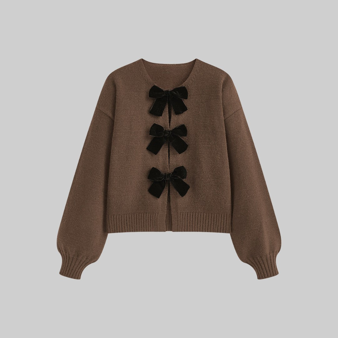 Stickad cardigan med sammetsrosetter och ballongärmar i mjuk stretchkvalitet