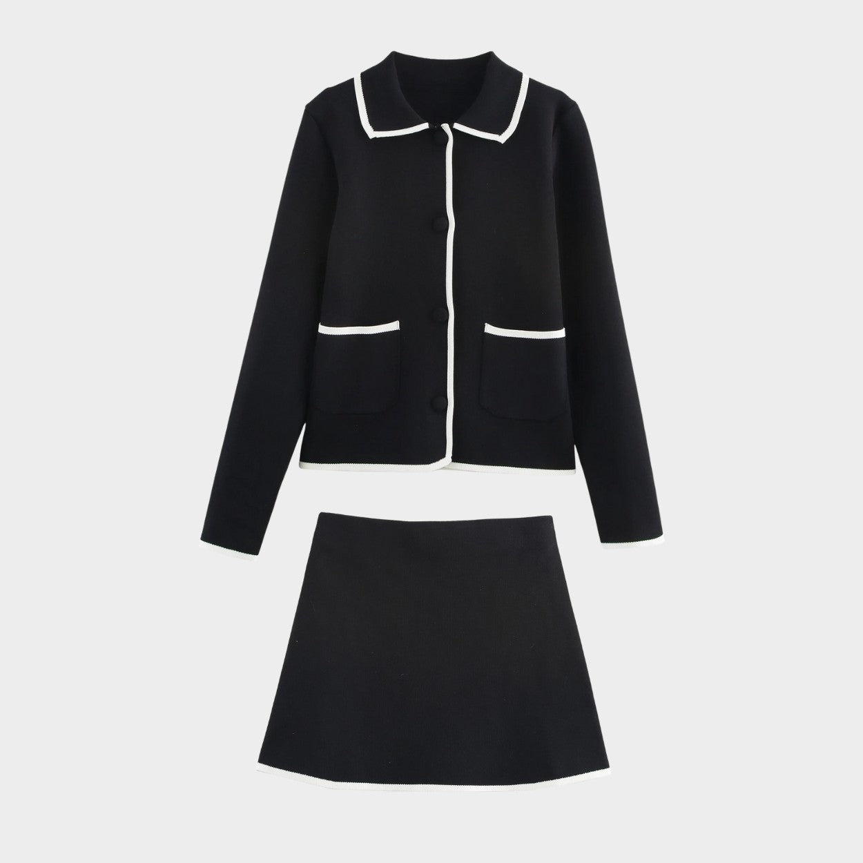 Elegant svart tvådelad stickad set med kofta och minikjol