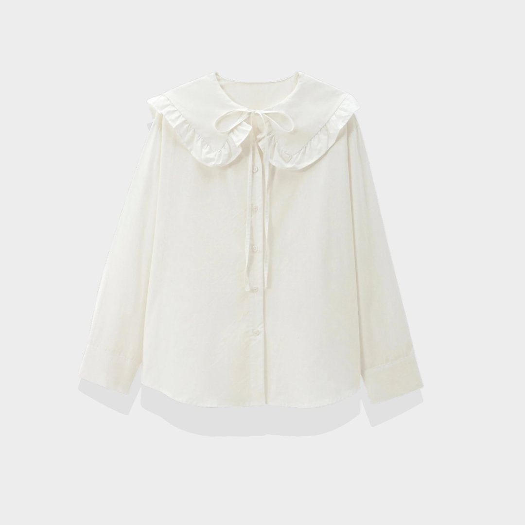 Klassisk blus med volangkrage knytband och eleganta detaljer