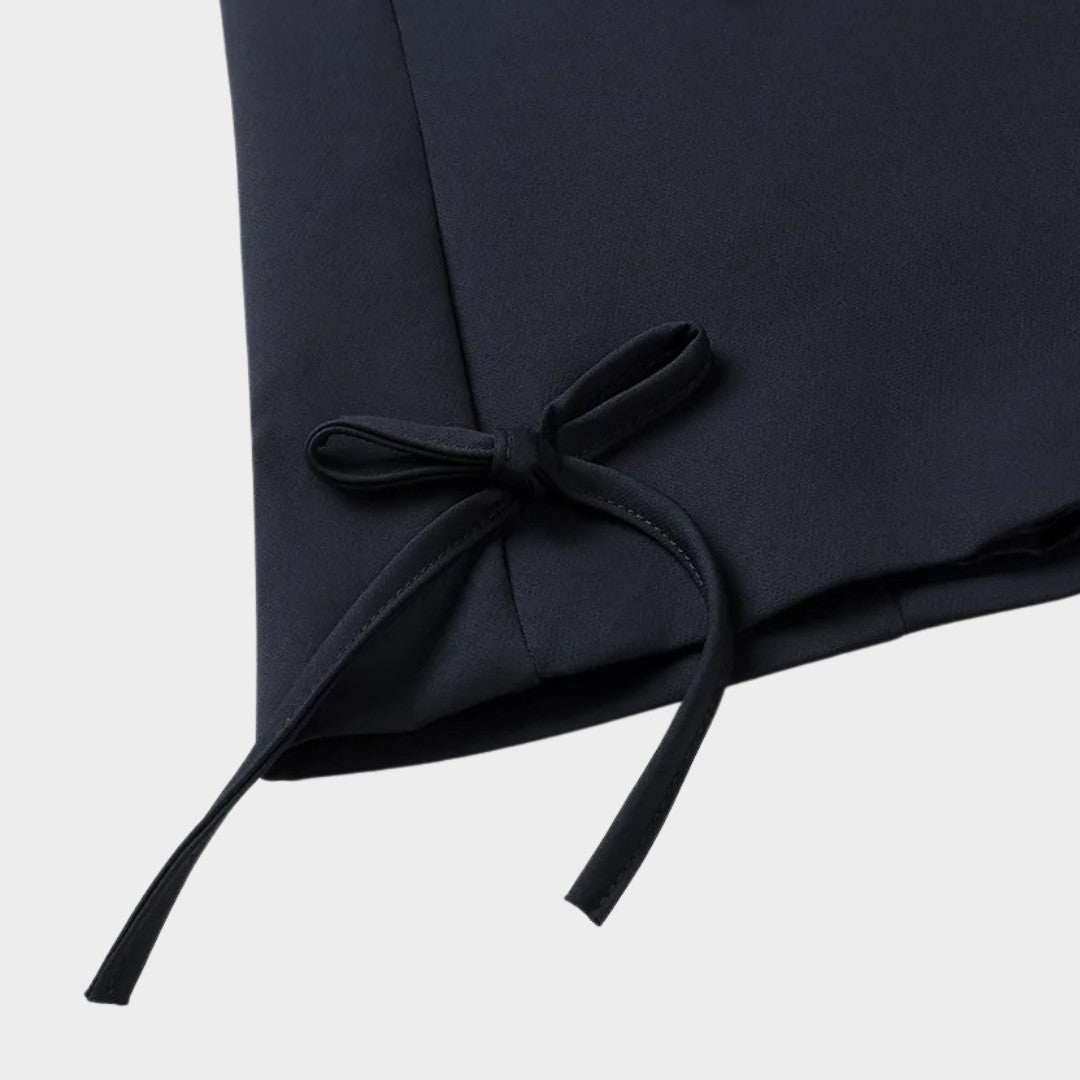 Enkelknäppt kavaj med slagkrage och dekorativa rosetter