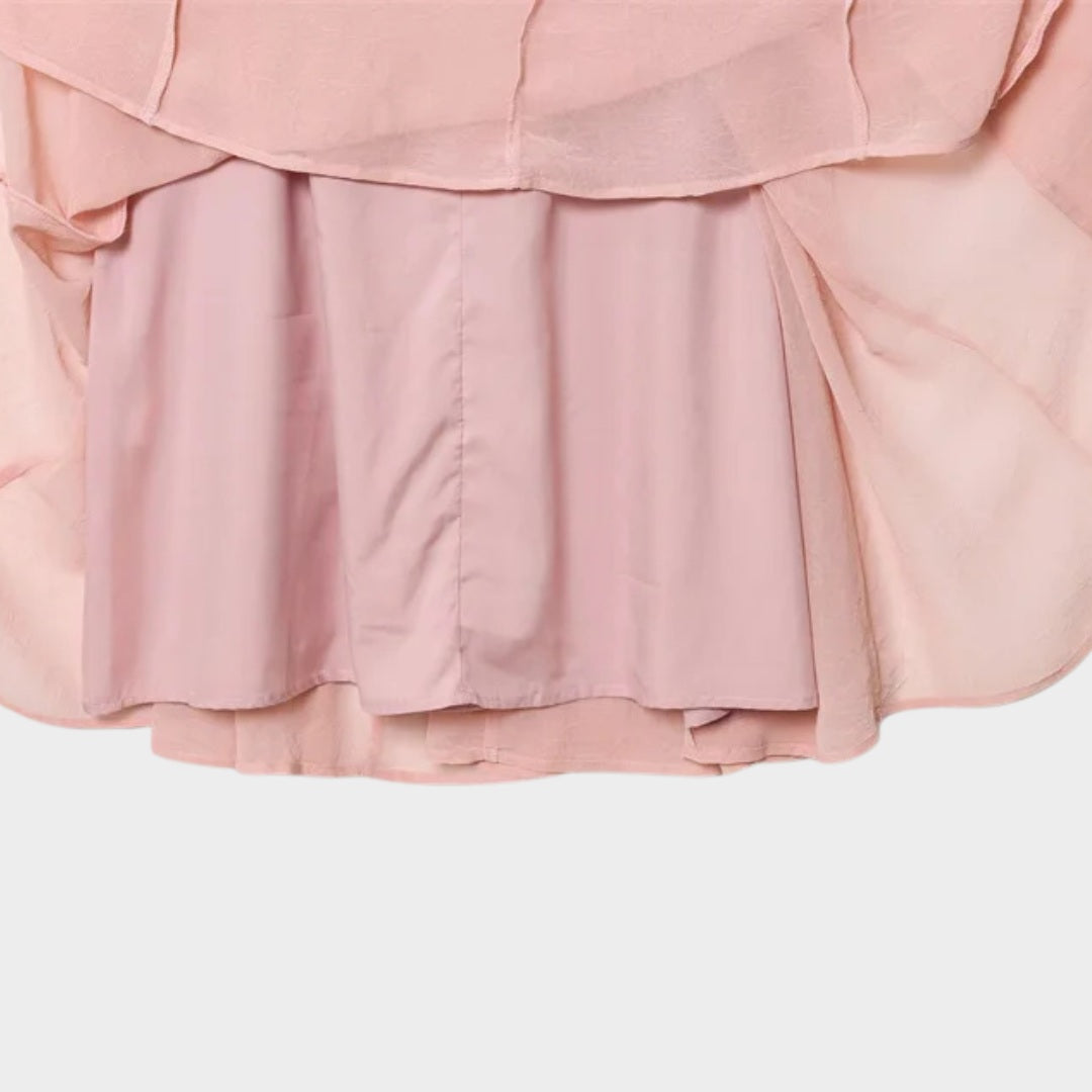 Ljusrosa Långkjol i ljusrosa med A-linjeform och svepande silhuett