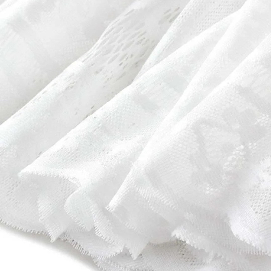 Kjol i spets med naturlig midja, ankellängd, A-linje silhuett och delikat struktur