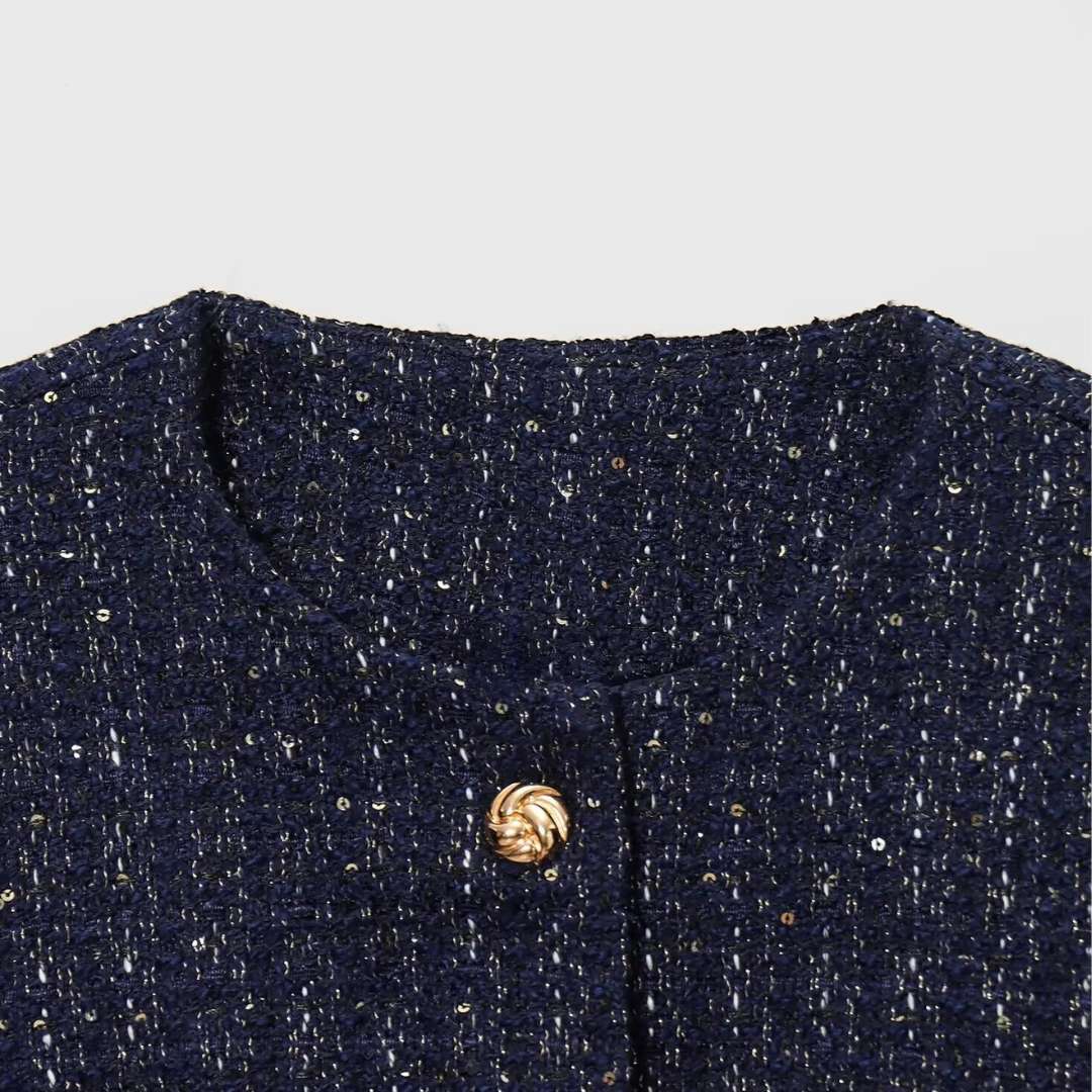 Jacka i tweedstil med rund hals paljettdetaljer och knäppning