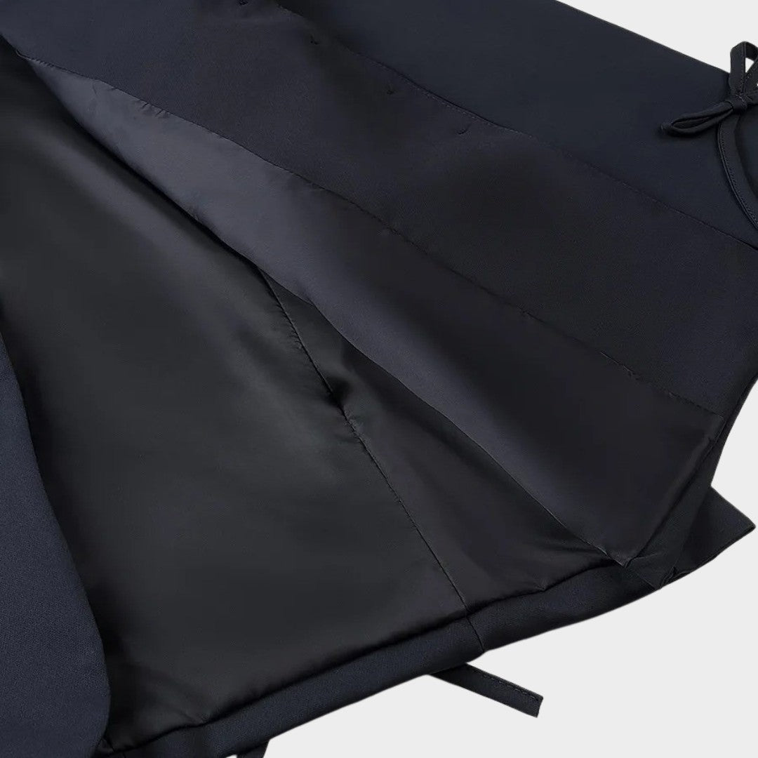 Enkelknäppt kavaj med slagkrage och dekorativa rosetter