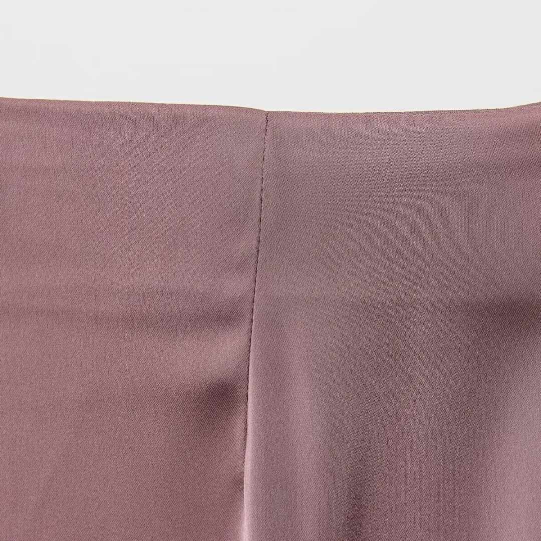 Tvådelat set med asymmetrisk topp och vida byxor – enfärgat eller prickigt