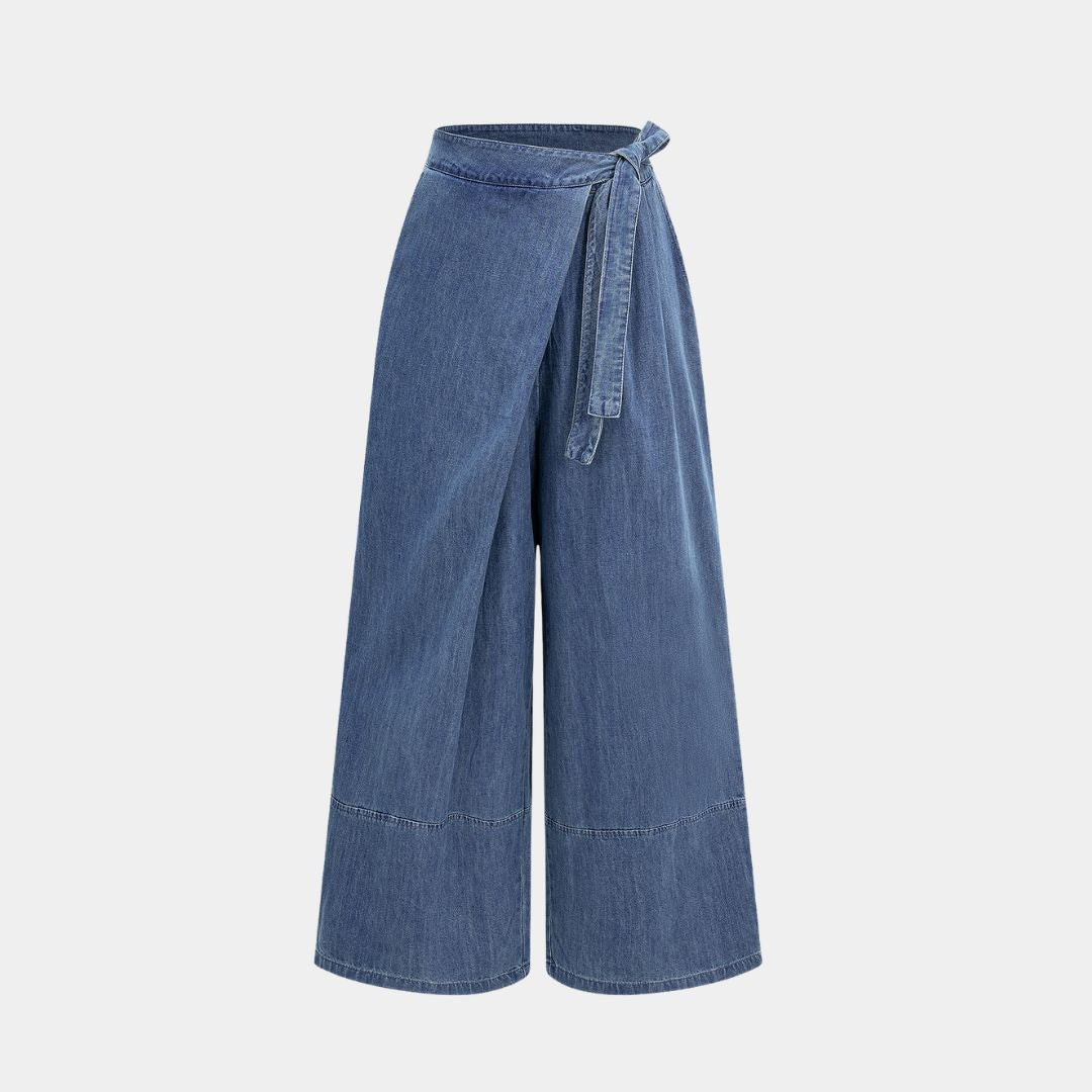 Blå omlottinspirerade denimbyxor med knytband i midjan, vida ben och sömdetaljer över knäna