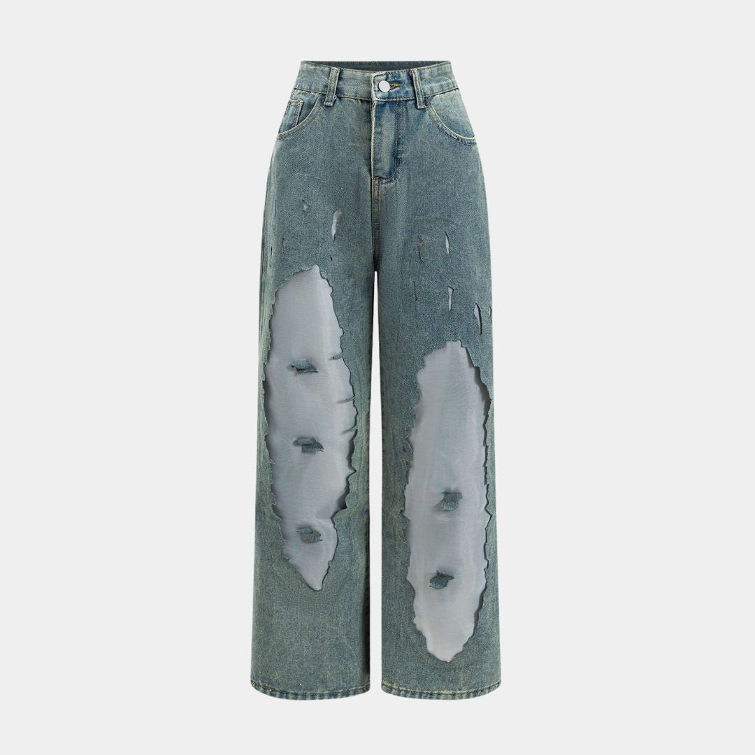 Höga ljusblå jeans med kraftiga slitningar, transparenta infällningar och bred rak passform i strukturerad denim