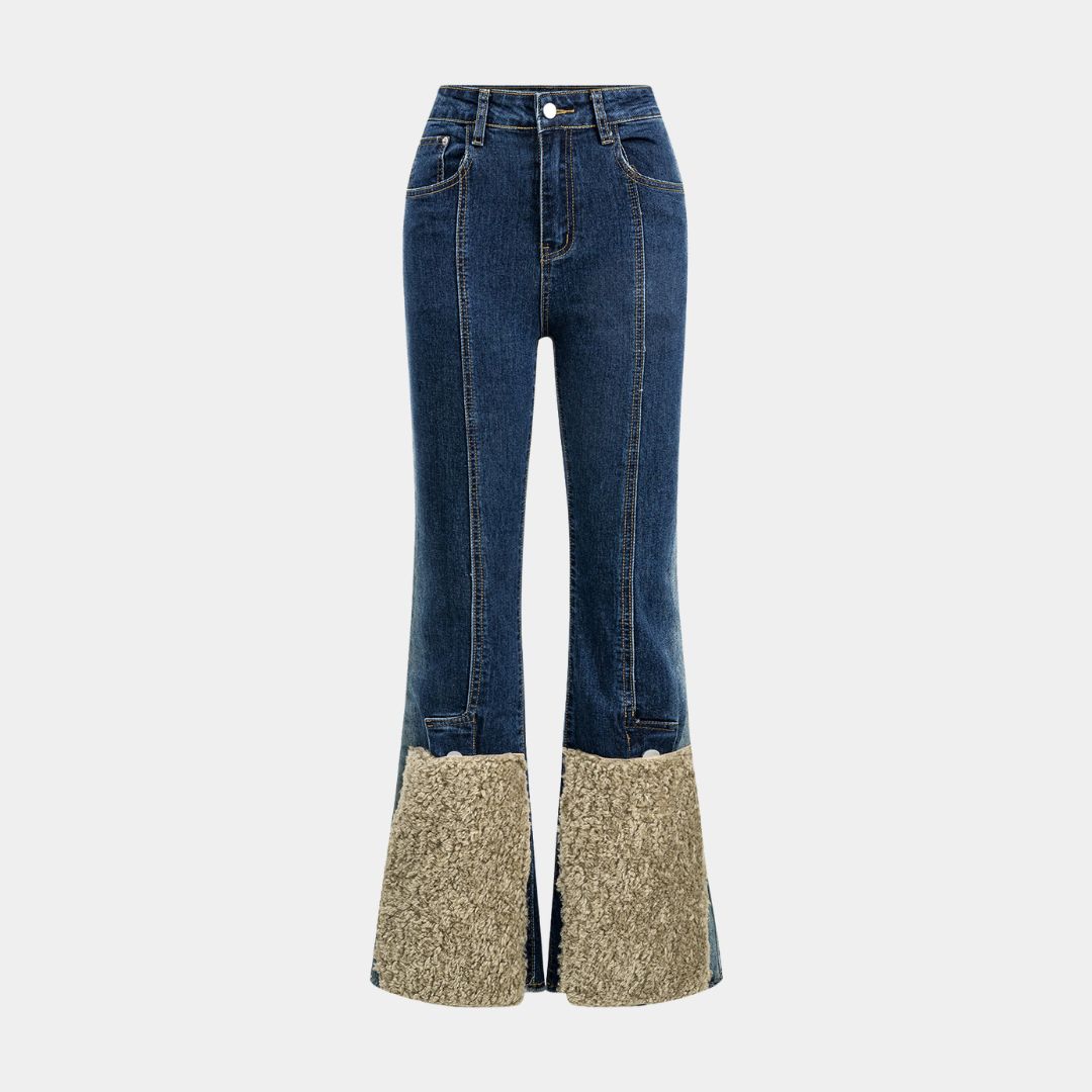 Mörkblå utsvängda jeans med hög midja, figursömmar och kontrasterande teddyfoder vid benslut