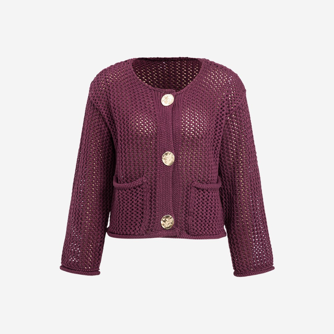 Stickad kofta i virkad struktur med fickor och stora dekorativa knappar