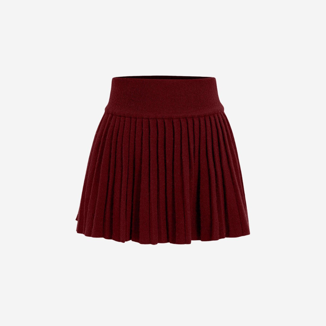 Plisserad stickad minikjol med elastisk midja och klassisk silhuett i mjuk ribbstickning
