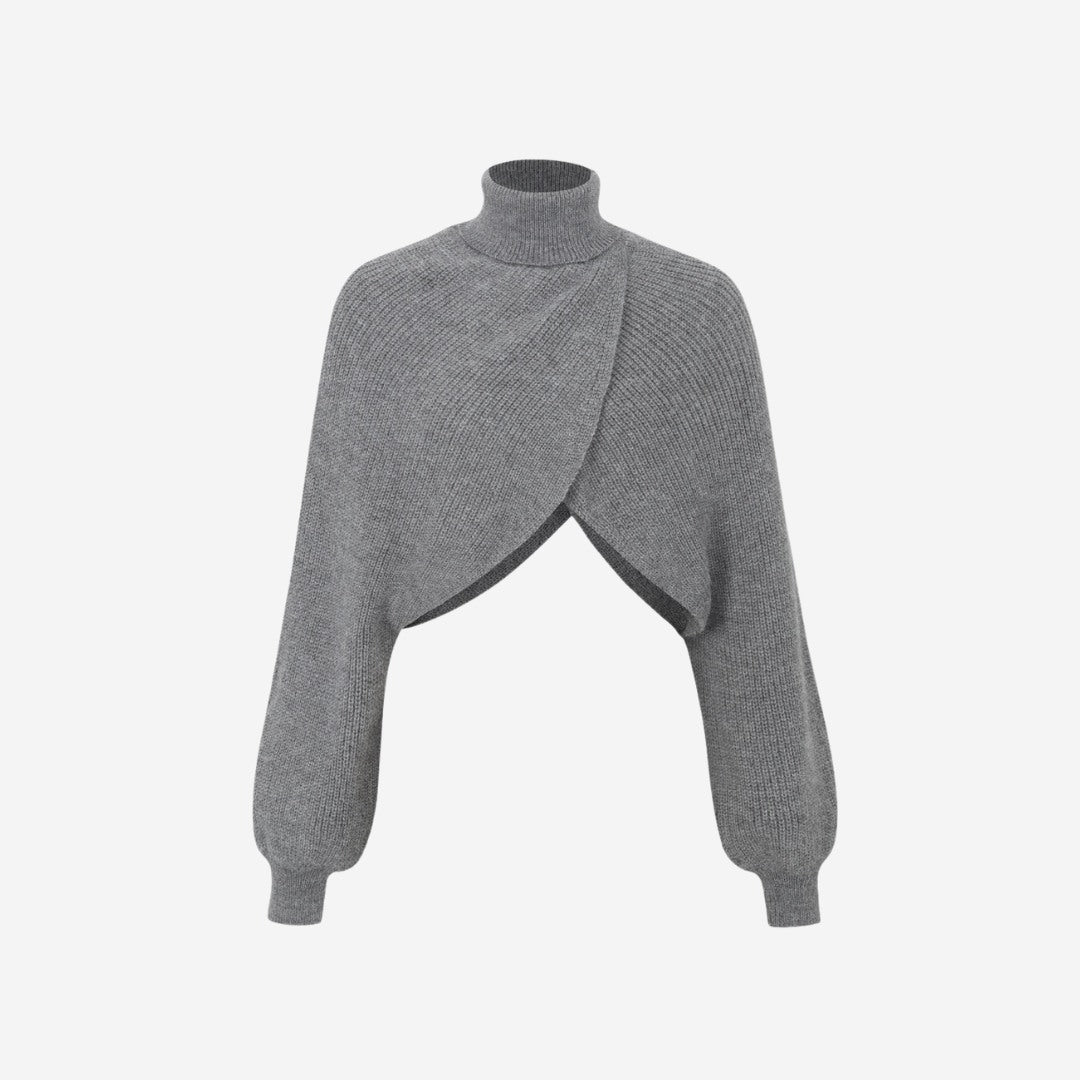 Stickad bolero med omlottdesign, polokrage och lös passform