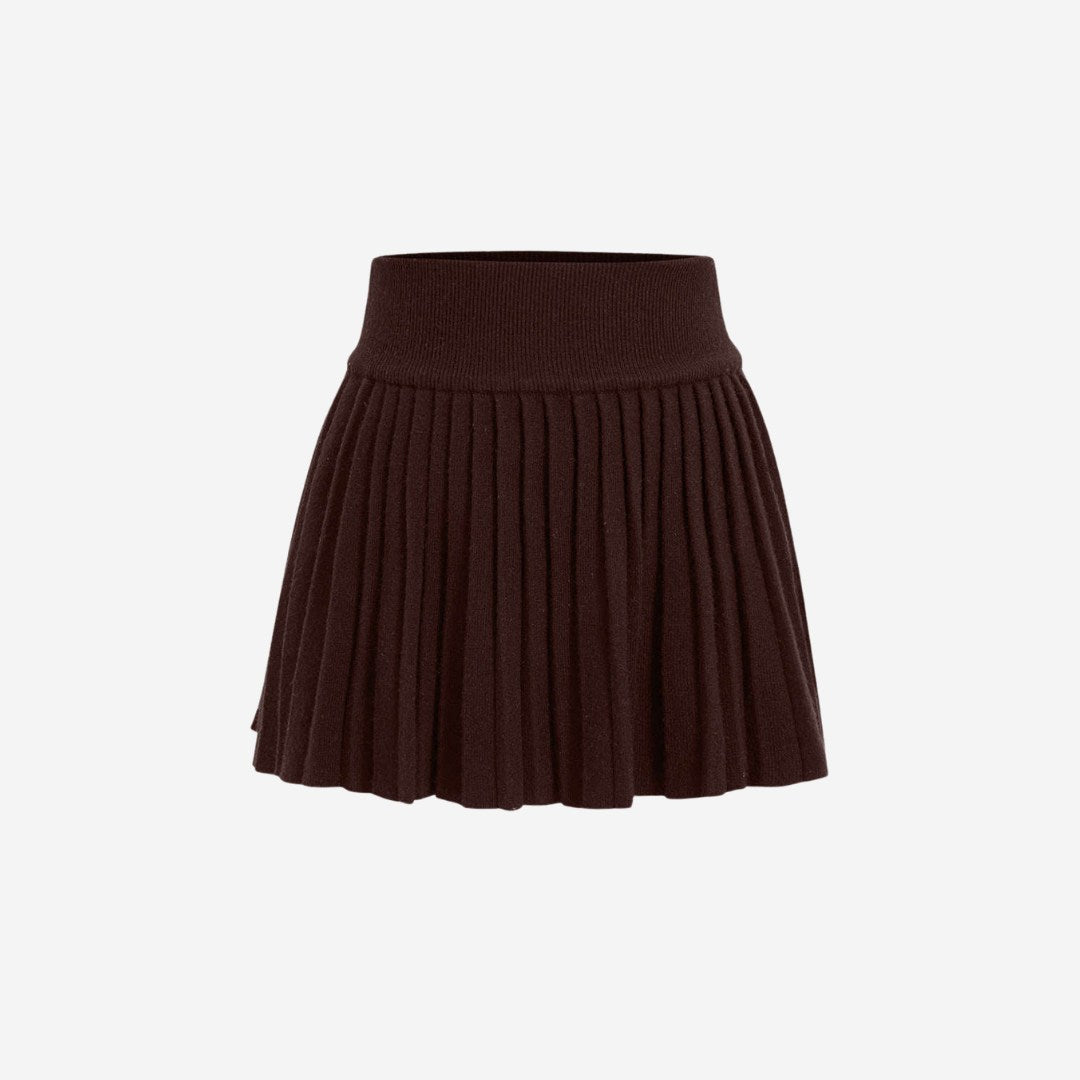 Plisserad stickad minikjol med elastisk midja och klassisk silhuett i mjuk ribbstickning