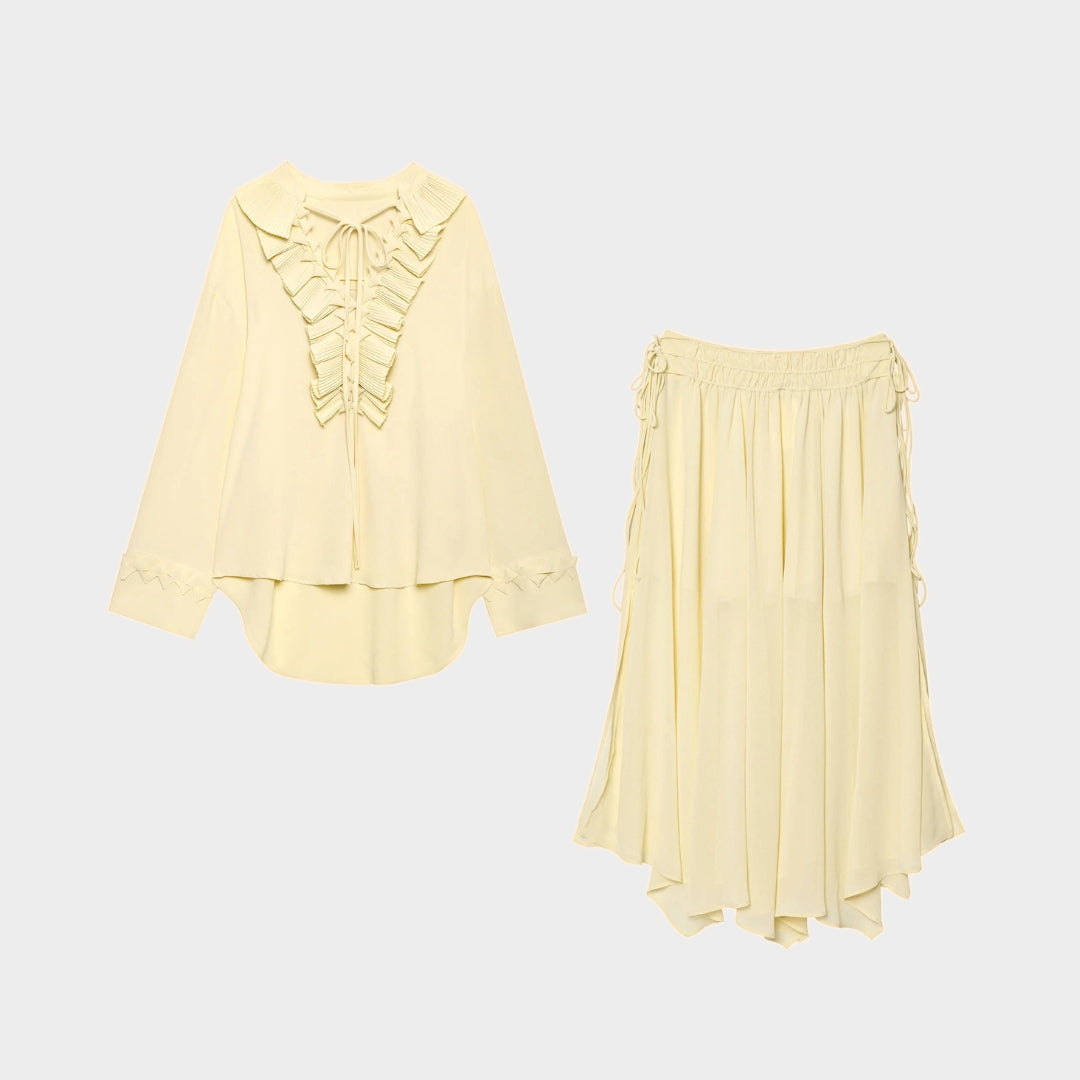 Blus med volangdetaljer och knytband samt asymmetrisk midikjol set