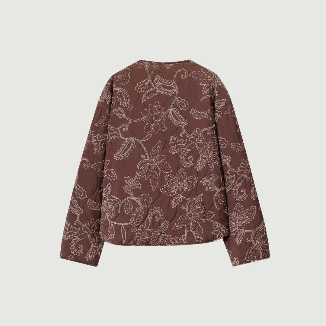 Kort blommönstrad vadderad jacka med broderi och rund hals