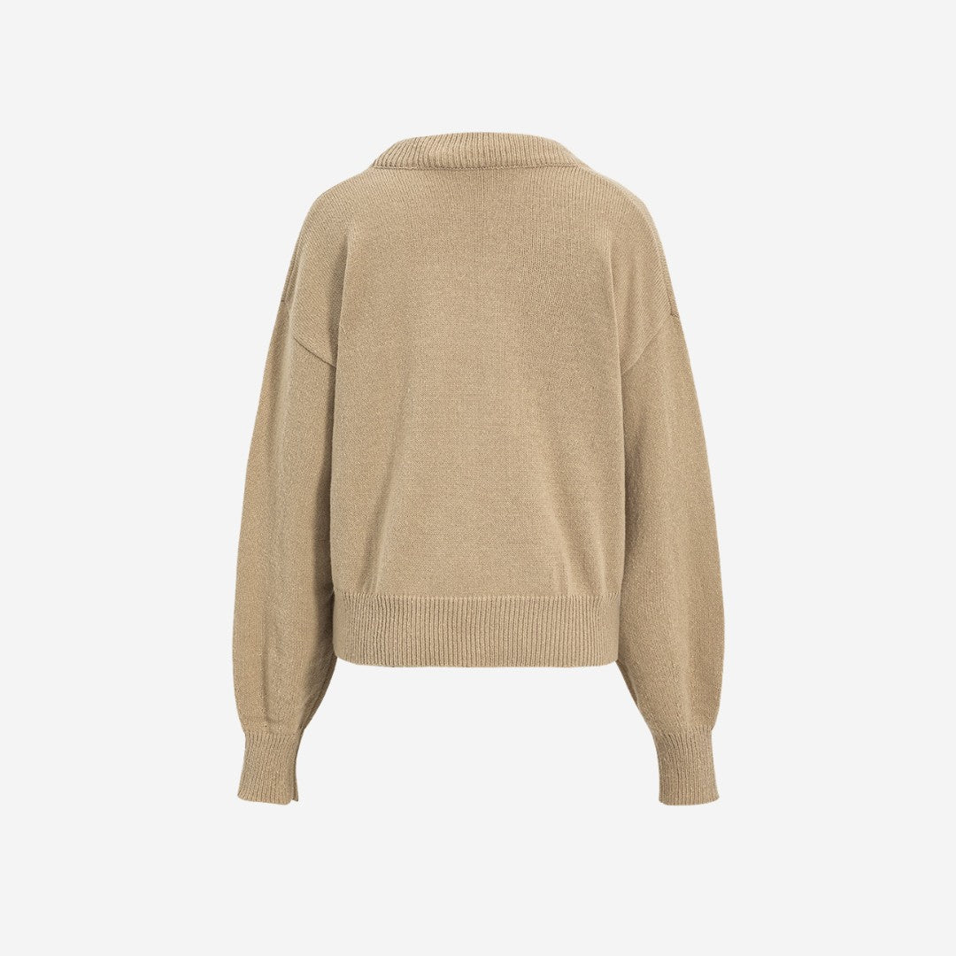 Beige oversize stickad tröja med bred V-ringning och ribbade muddar