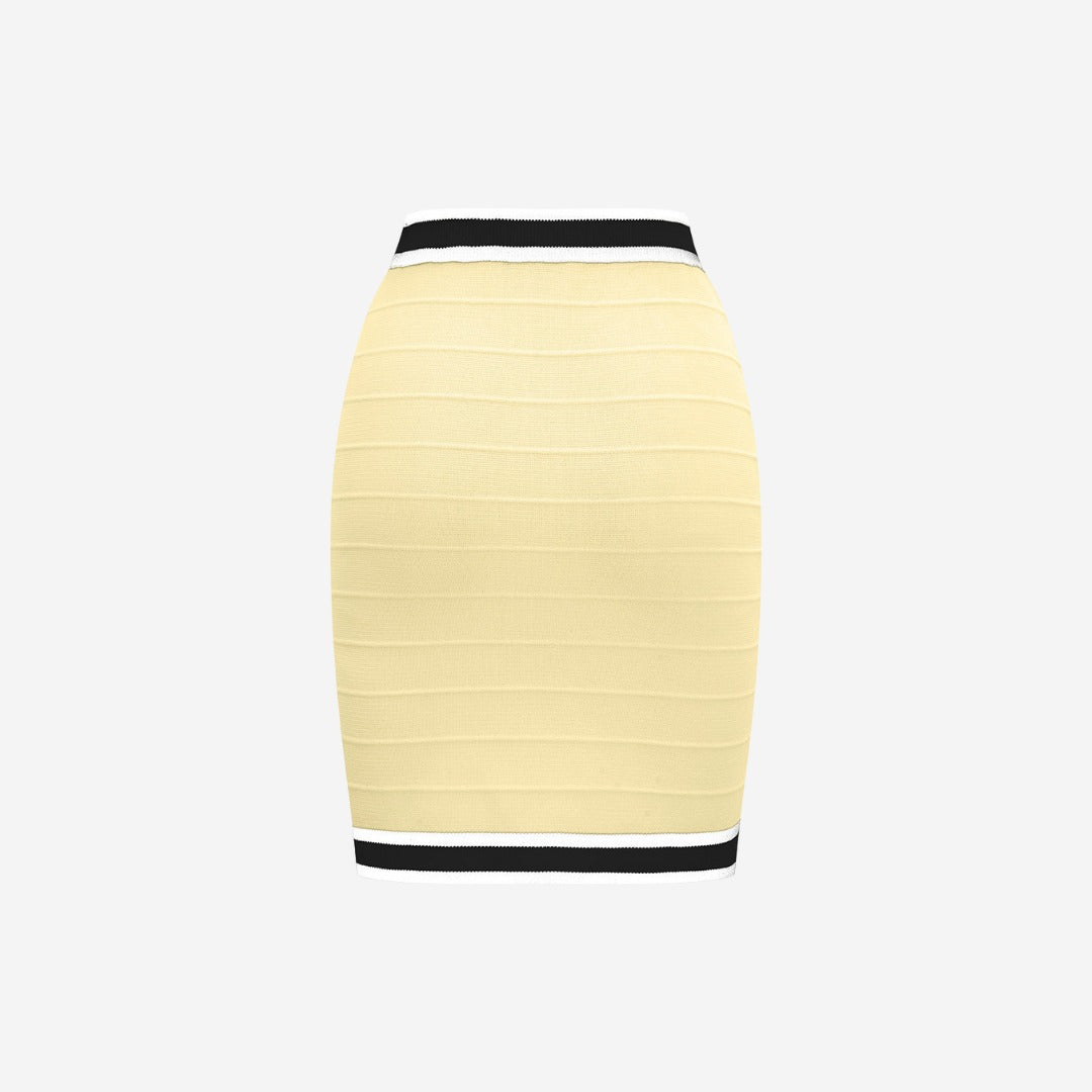 Kroppsnära stickad kjol i trikå med dekorativa knappar och kontrastkant