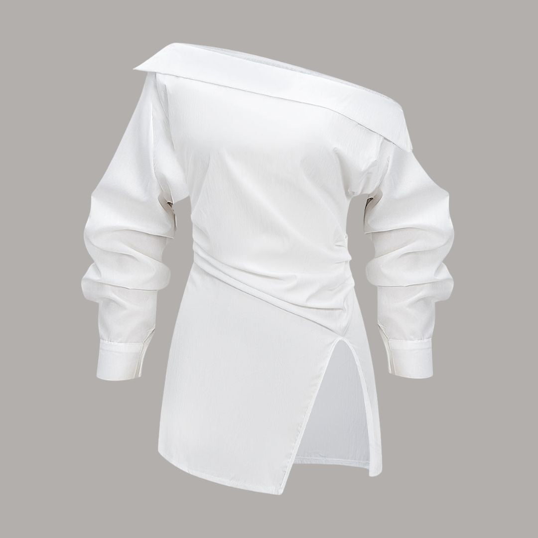 Asymmetrisk topp med bar axel och markerad midja stilren design med skulptural silhuett