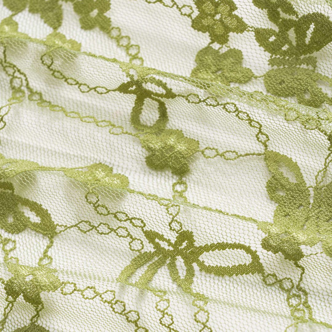 Limegrön satintopp med spetsinslag och knytband i midjan