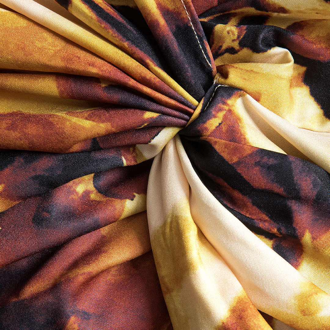 Gul lång skjortklänning med knutdetalj i midjan ballongärmar och konstnärligt tryck