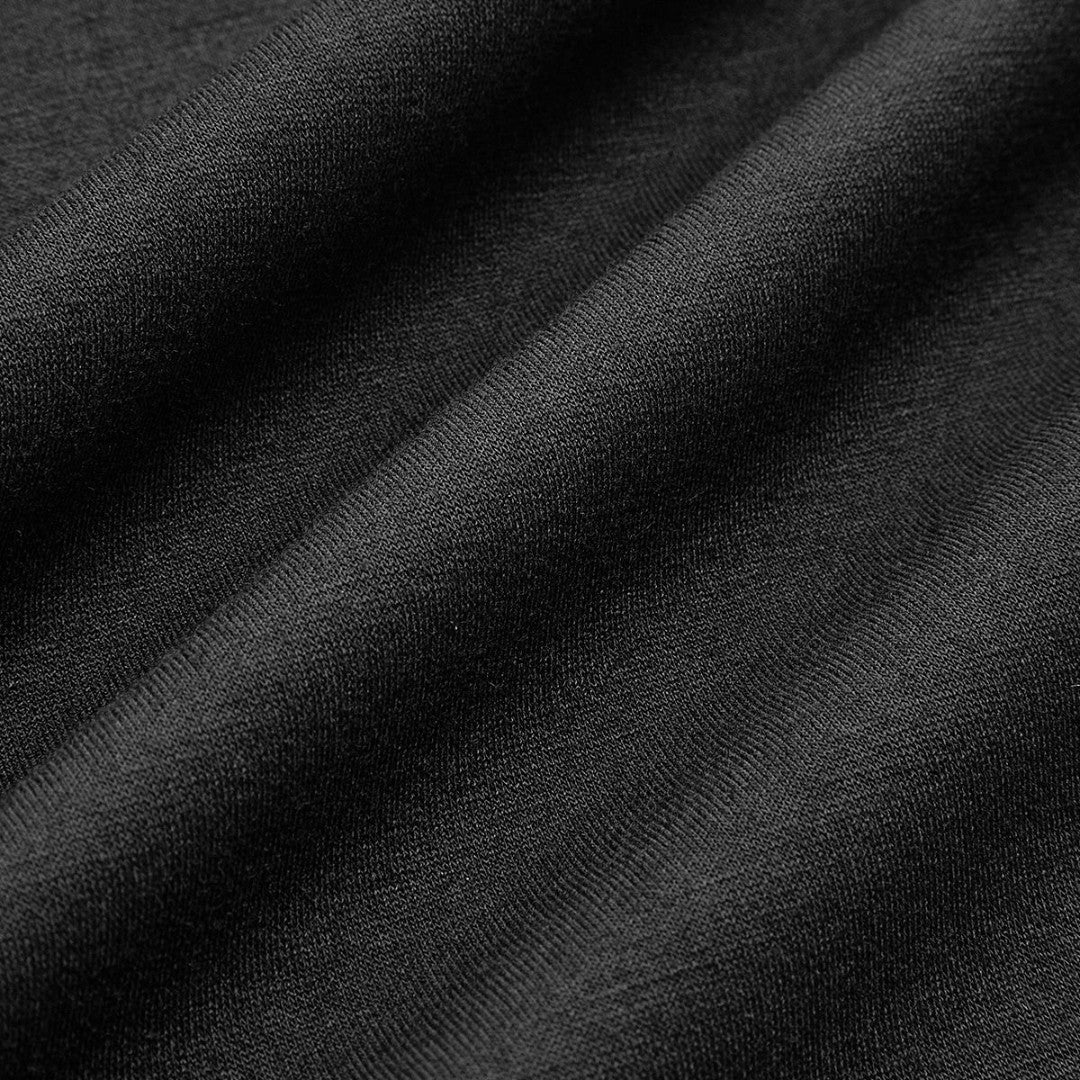 Kort stickad jacka med deniminsats och vida ärmar