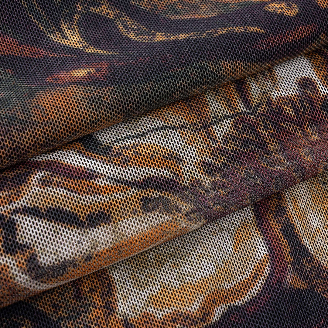 Meshklänning figurnära slim fit med semi transparent tyg unikt tryck ärmlös