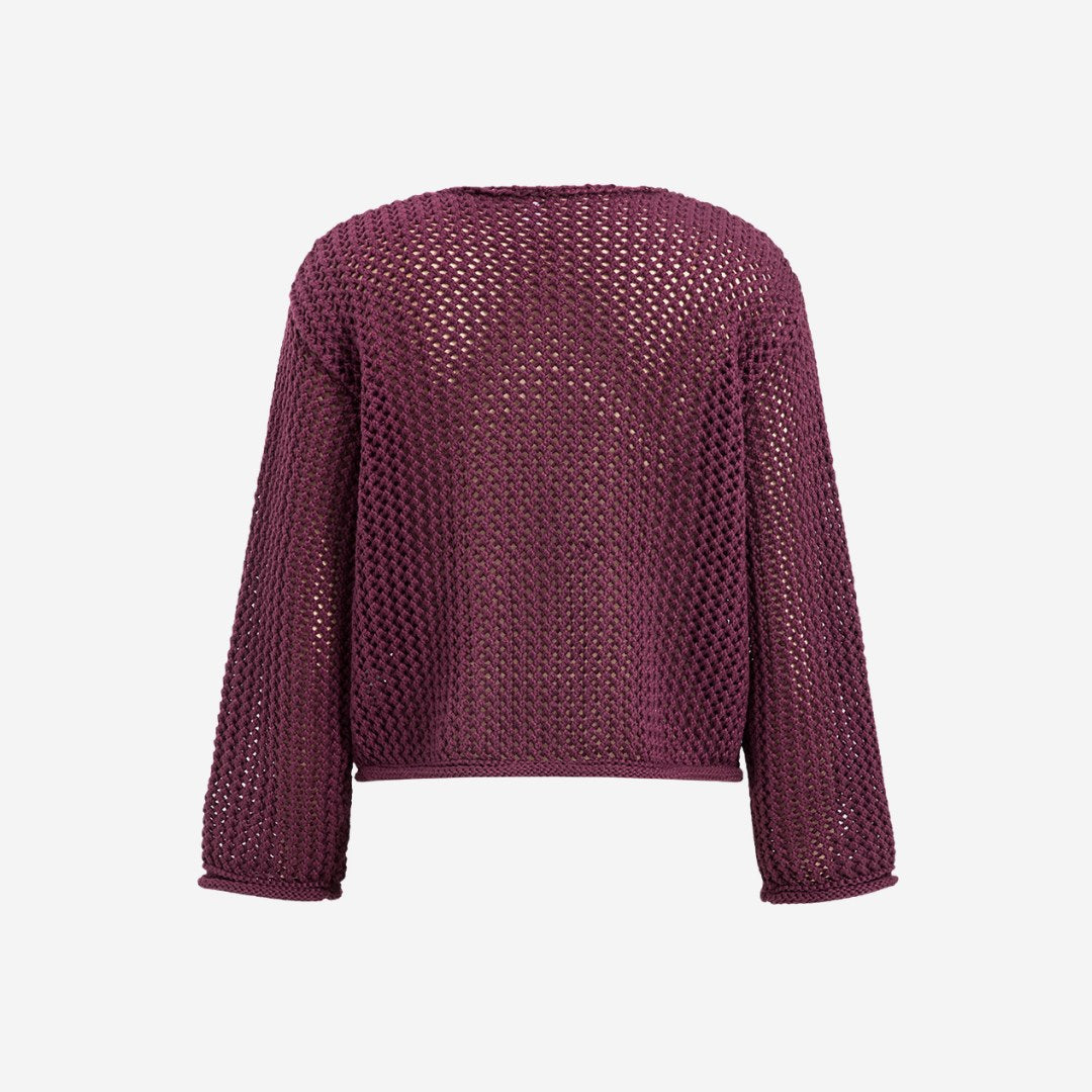 Stickad kofta i virkad struktur med fickor och stora dekorativa knappar