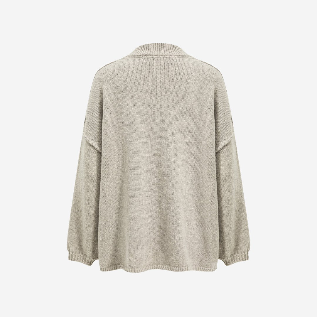 Stickad kofta med rund hals, knappstängning och långa ärmar med ribbade muddar