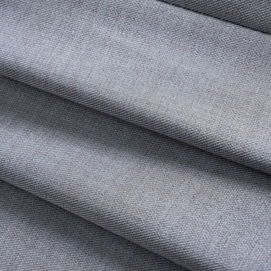 Grå figursydd väst i twill med djup V-ringning och guldfärgade rosformade knappar för dam