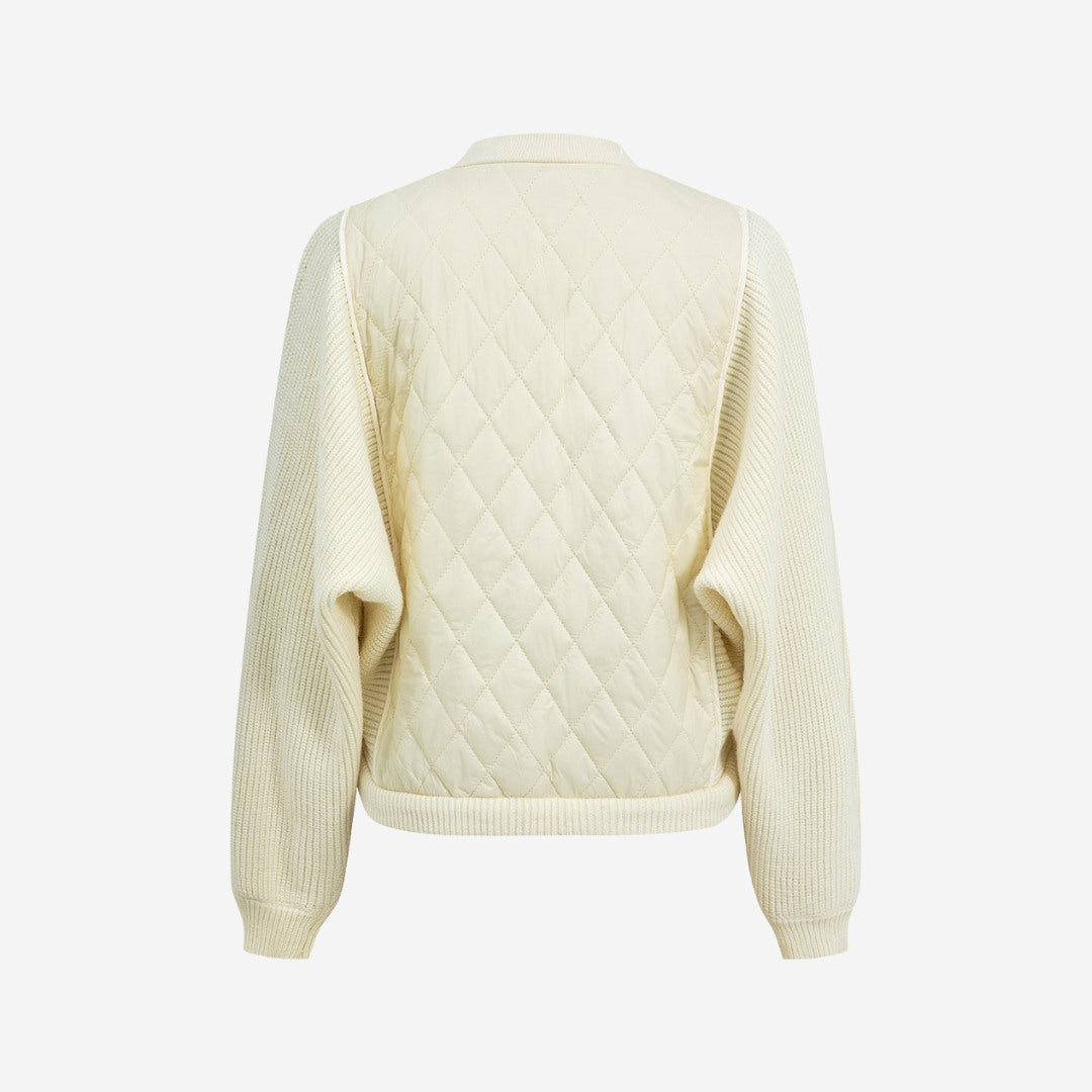 Stickad kofta med quiltade paneler och dragkedja framtill