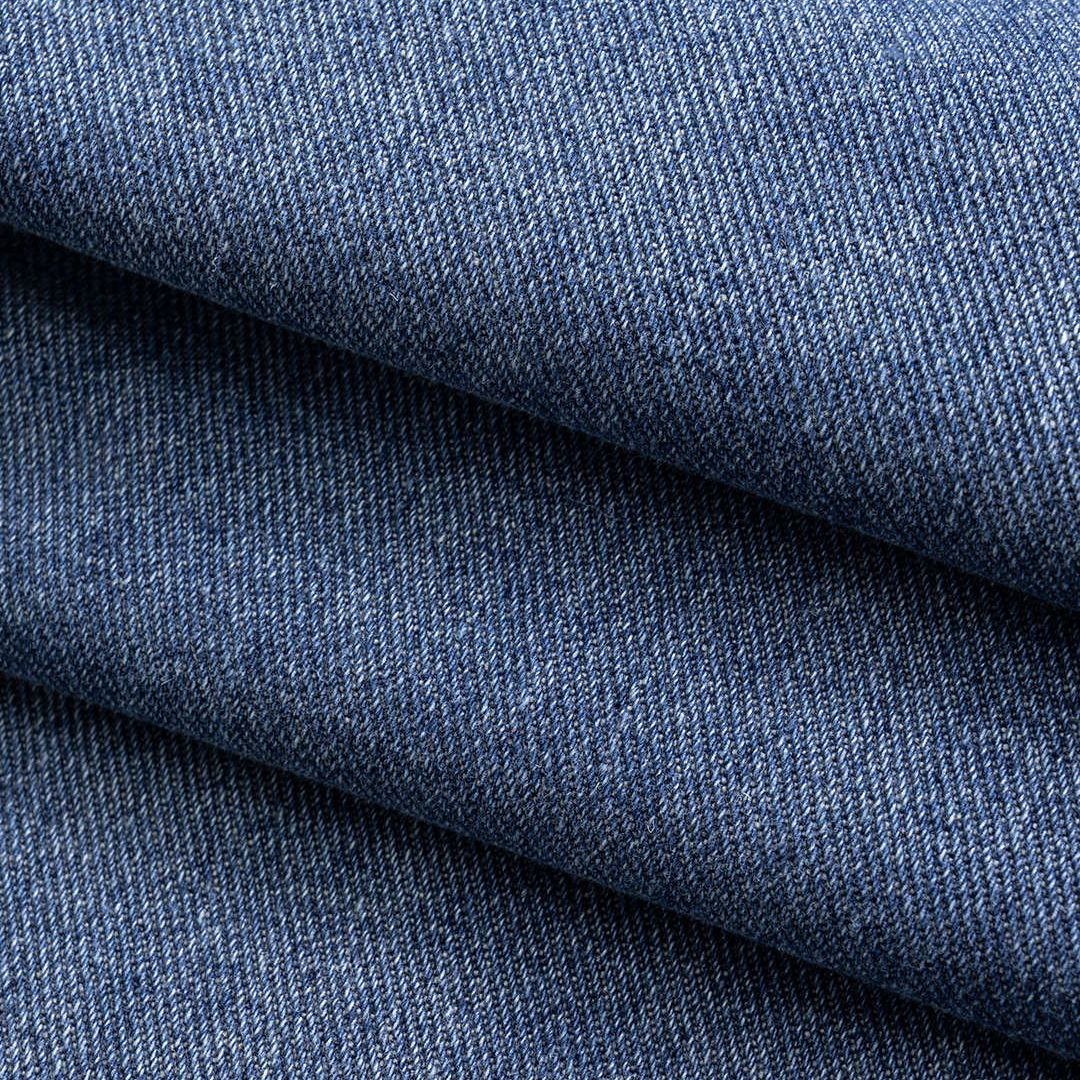 Mörkblå denimbyxor med veckade sidsömmar, panelkonstruktion och bred silhuett i kraftig tvättad bomullsblandning