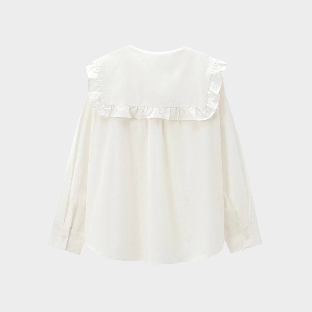 Klassisk blus med volangkrage knytband och eleganta detaljer
