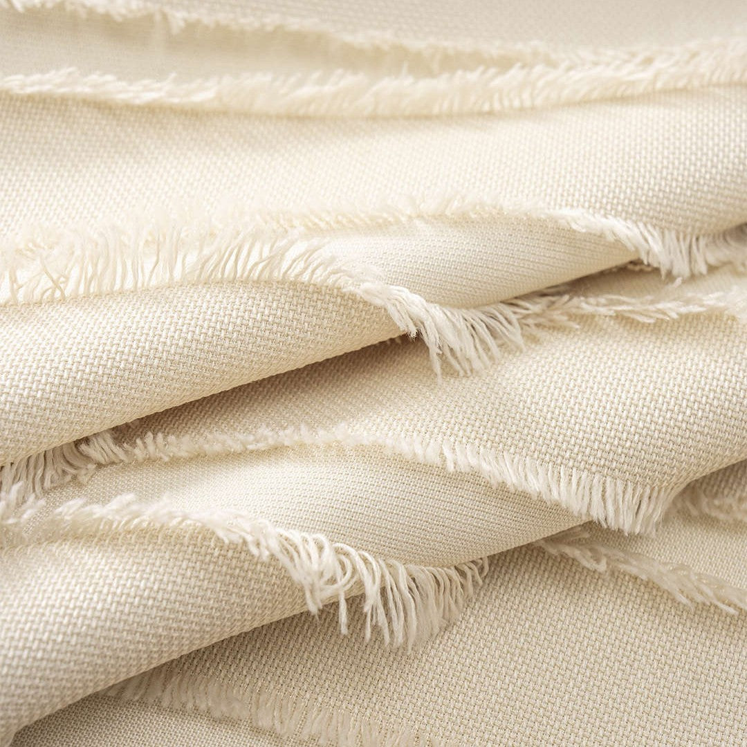 Krämvit midiklänning med knytbara axelband, strukturerad textur och A-linjeform