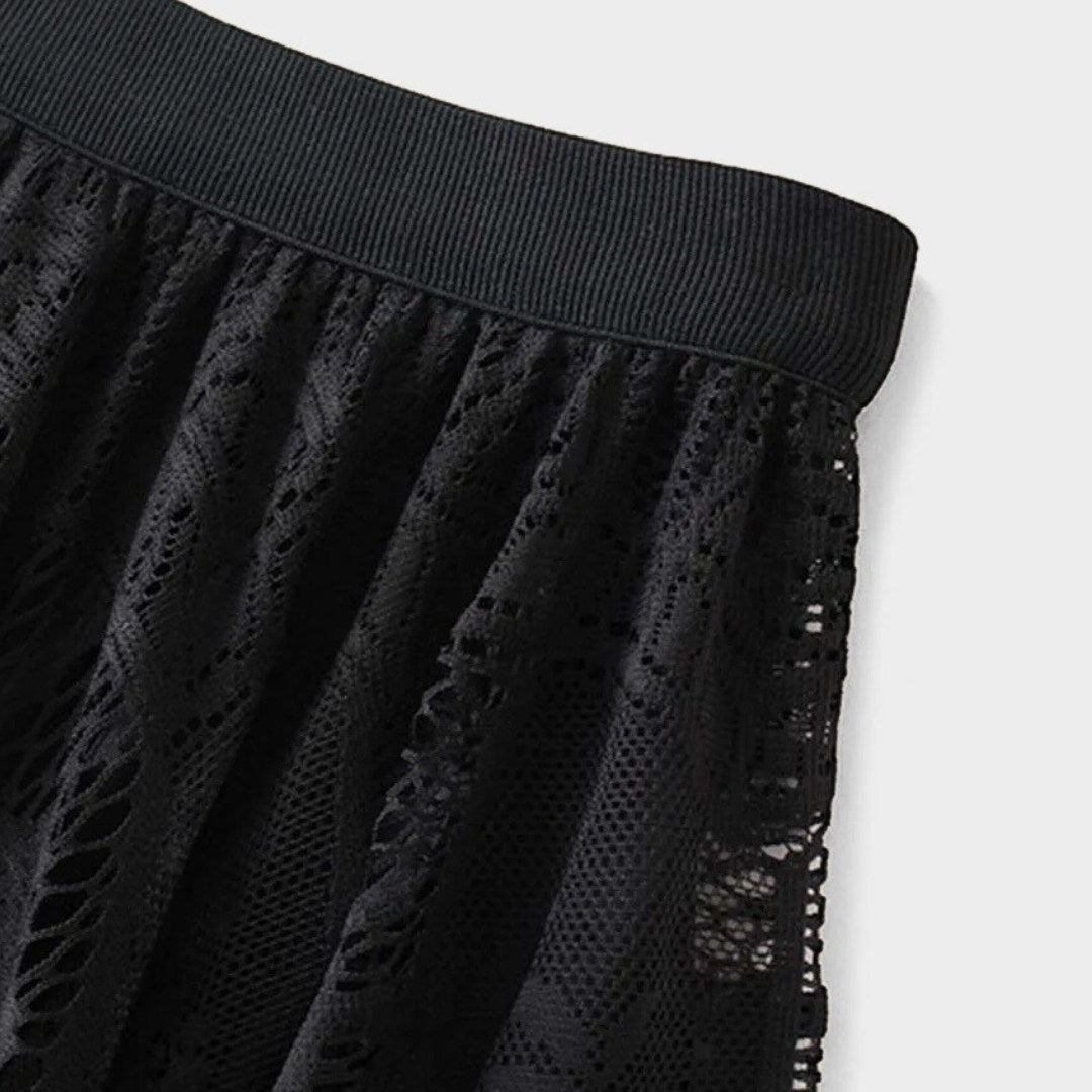 Kjol i spets med naturlig midja, ankellängd, A-linje silhuett och delikat struktur