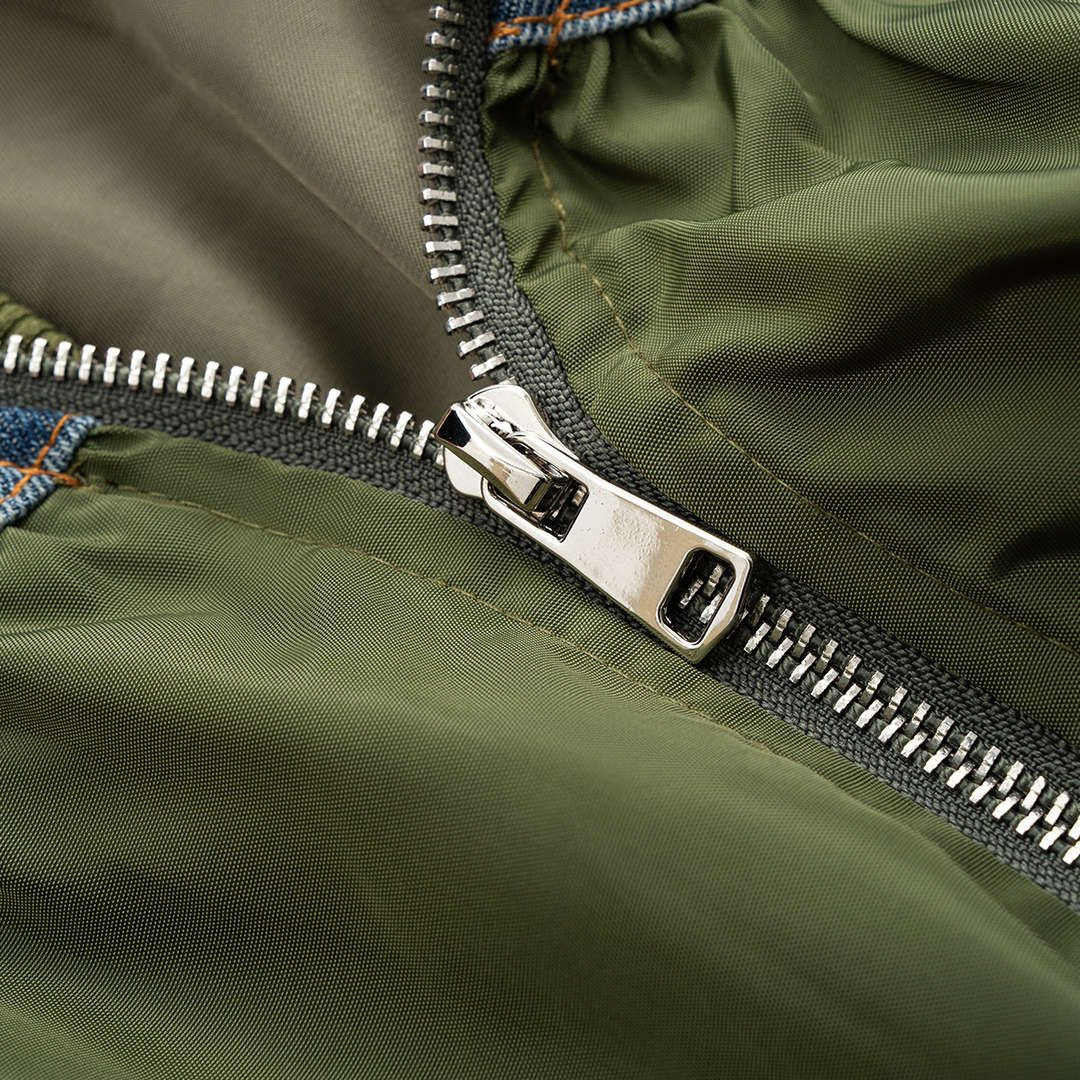 Grön bomberjacka med denimdetaljer i patchwork